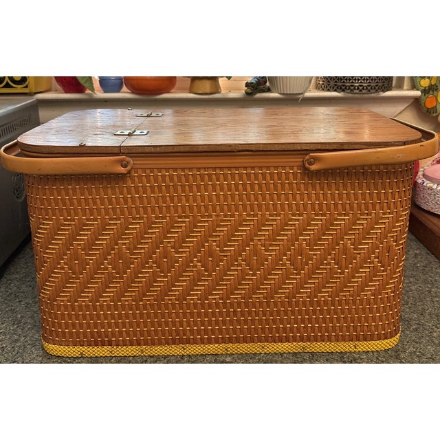 Capture the charm of vintage outdoor living with this authentic 1970s Redmon woven picnic basket. Featuring classic Mid-...