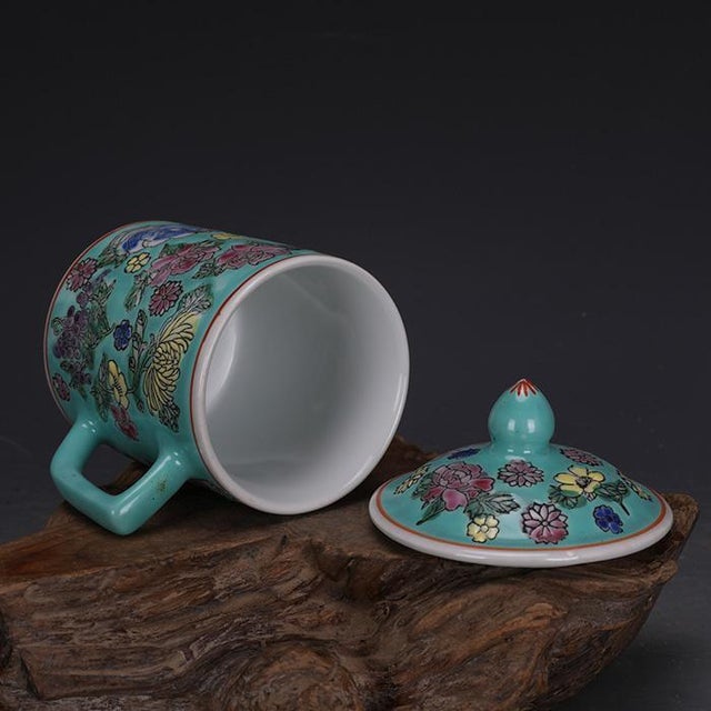 Add a pop of color to your morning routine or decor collection with this charming ceramic lidded mug. This piece features...