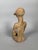 Bankoni statuette, Mali, 13th-15th century, ochre terracotta. The statuette represents a seated female figure, her legs...