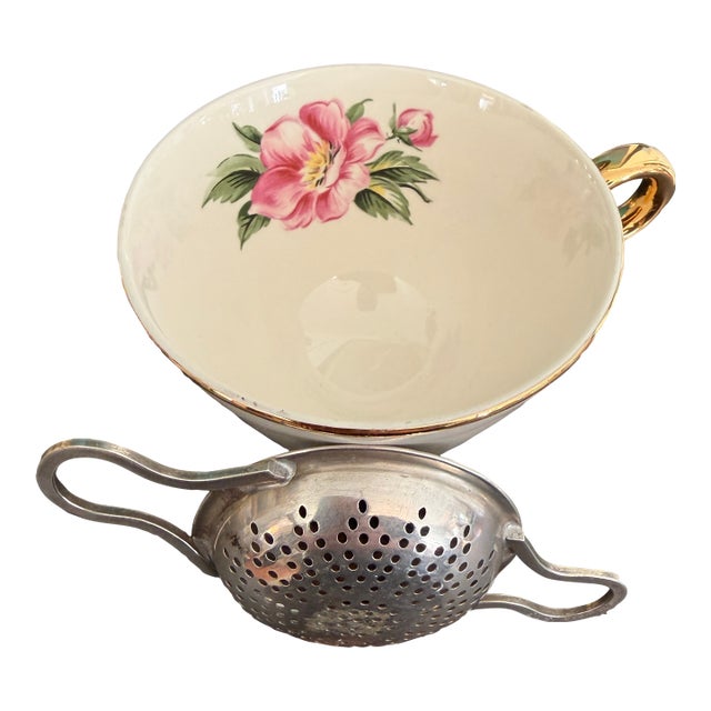 International Silver Co. over-the-cup individual tea strainer with handles. This unique tea tool levels up the elegance of...