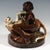 Rare and exceptional goldscheider art déco ceramic group of the 1920s: unclothed woman sitting sideways on a rock, leaning...