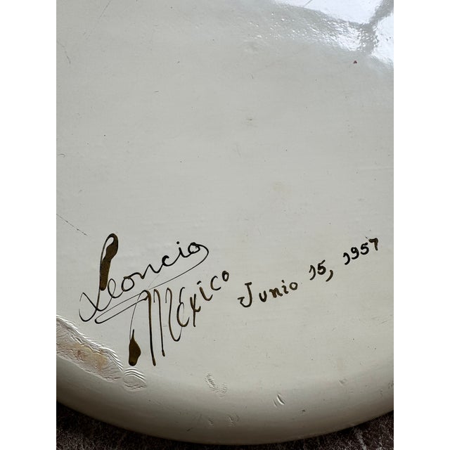 Exceptional hand-painted Mexican decorative plate, signed and dated “Mexico – Junio 15, 1957.” The plate features a bold...