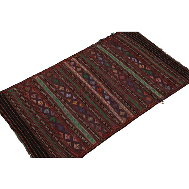 Handwoven in wool circa 1950-1960, this 4x7 vintage tribal Baluch kilim rug is the latest to join Rug & Kilim’s collection...