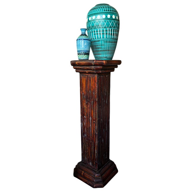 Sculptural vintage bamboo pedestal with an octagonal top and base, featuring vertical reed detailing and a deep, naturally...