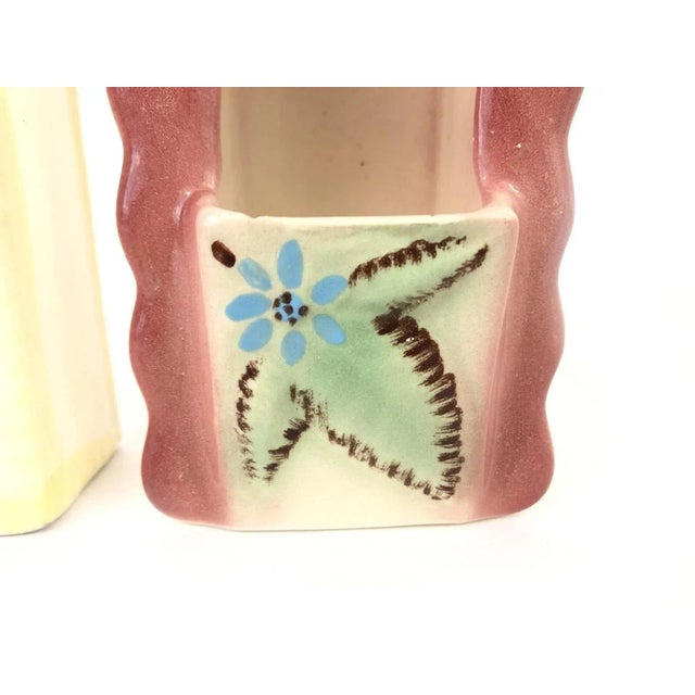 Embrace the charm of mid-century decor with our ceramic wall pockets, a delightful addition to any room seeking a touch of...