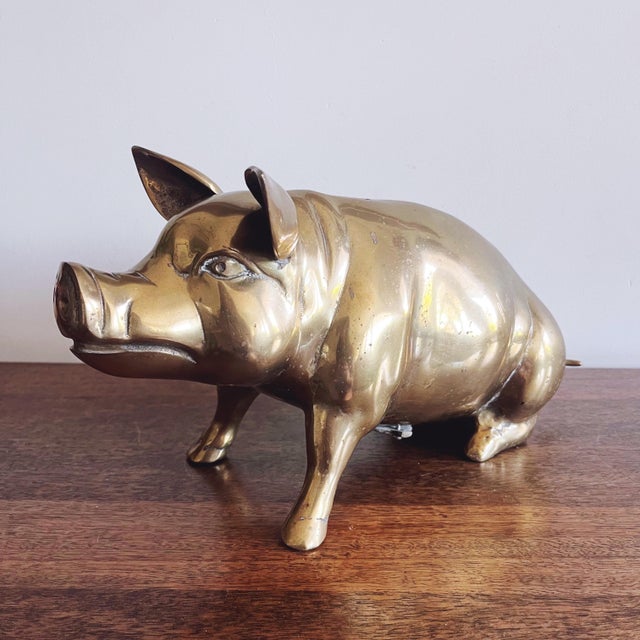 Vintage brass piggy bank, made in Korea in the 1960s. Lovely condition! 14” x 5” x 7”