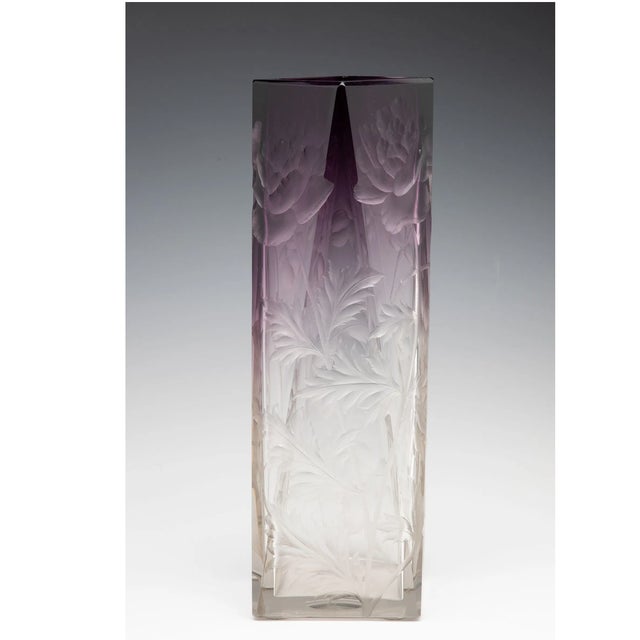 A striking early 20th century cut crystal vase attributed to Ludwig Moser, expertly carved with large flower heads and...