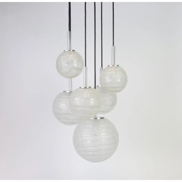 A special large cascading chandelier by doria, manufactured in germany, circa 1970s with 6 murano ice glasses. Wonderful...