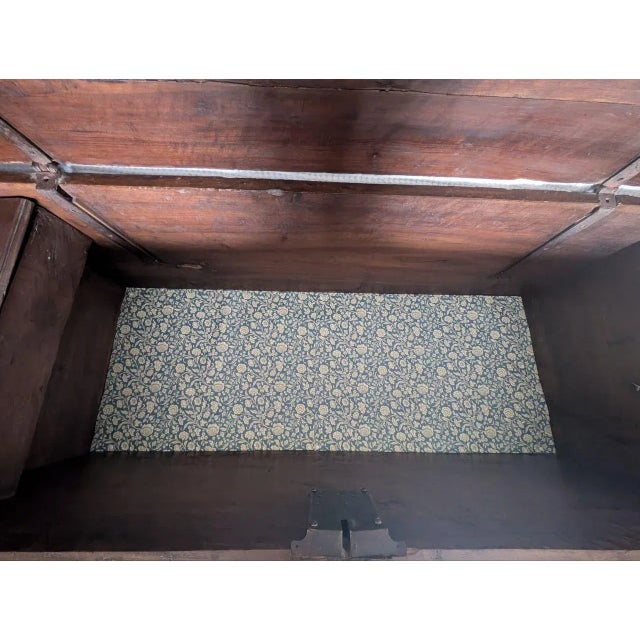 A splendid late 17th-century chest, made of solid walnut with lighter inlays. It features lion's paw-shaped feet. The...