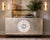 Striking Theodore Alexander two-door credenza featuring a textured silver-leaf finish with visible wood grain and a...