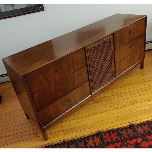 Here's a super sleek nine drawer sideboard or long dresser created by American of Martinsville. Has a contemporary Asian...