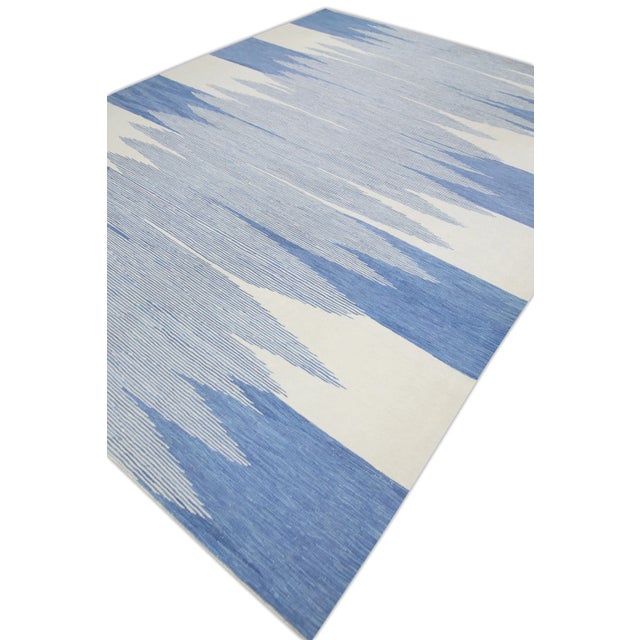 This exquisite Turkish flatweave kilim rug is a stunning masterpiece of traditional craftsmanship. Each rug is...