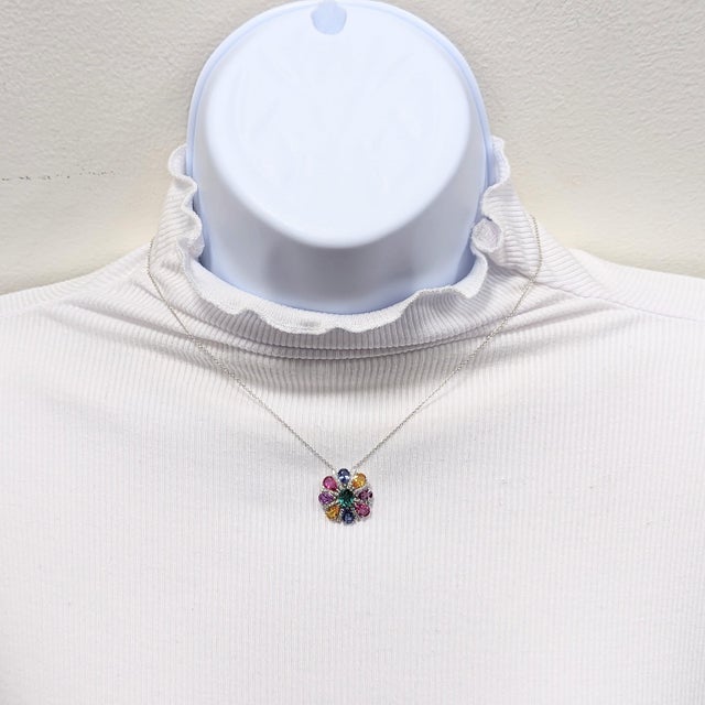 Stunning 3.75 ct. multi color sapphire pear shapes with a nice emerald oval in the center and 0.25 ct. good quality white...