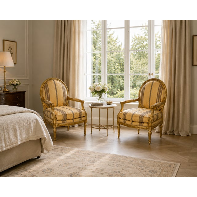 A very elegant set of antique French giltwood bergère armchairs, shaped in the Louis XVI taste with carved frames and soft...