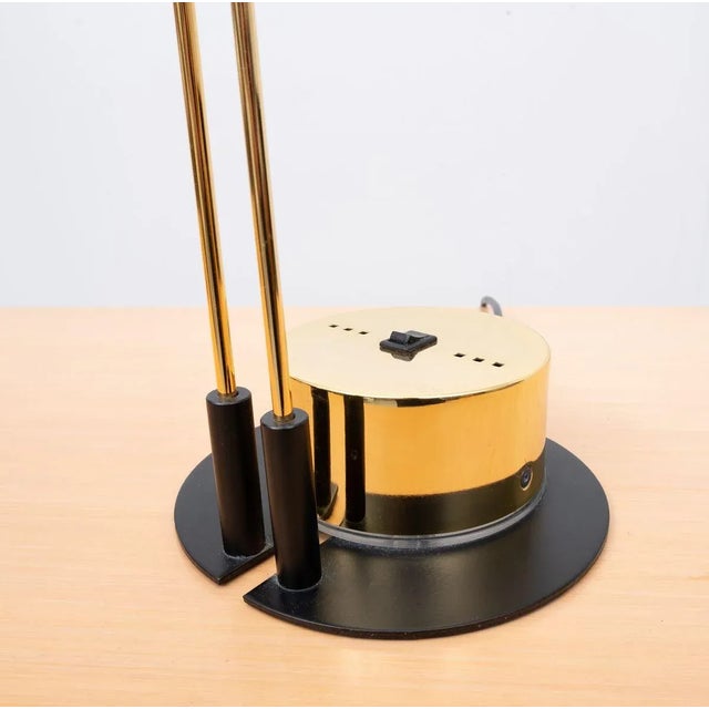 Two outstanding and rare Postmodern table lamps. Brass wings and base, frosted glass tube shade. Beautifully made, like a...