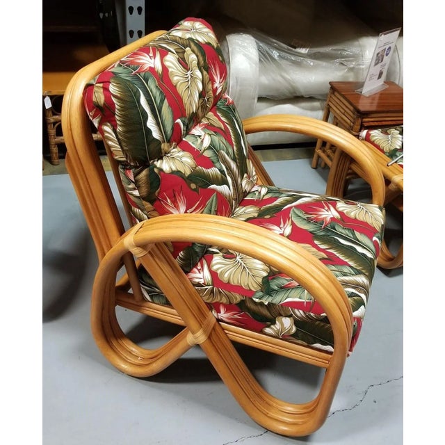 Restored rattan 3-Strand pretzel armchair with red and white birds of paradise tropical barckcloth cushions and a matching...
