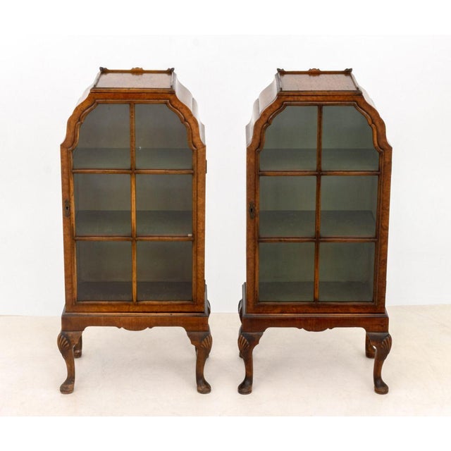 Pair of Queen Anne Style Burl Walnut Cabinets, each with single glass paned door with three green painted shelves on four...