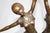 After demétre chiparus. An art deco style bronze figure of two dancers. Mid-20th century. Of mid brown patination. On a...