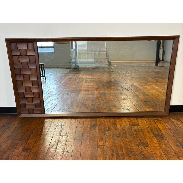 Stunning large midcentury brutalist wall mirror by Tobago of Canada constructed of solid walnut. Mirror can be hung...