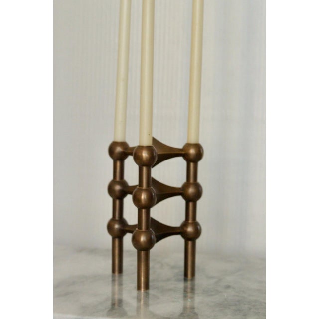 A set modernist brass candlestick by fritz stoff nagel dimensions h 10.5cm x 7 cm these extraordinary pieces are highly...