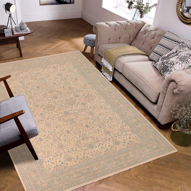 Enhance the ambiance of your home with this magnificent Persian-influenced Turkish hand-knotted rug made by skilled...