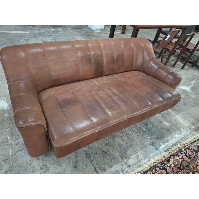 De Sede DS44 3-seater sofa, 1970s. Beautifully patinated high quality Swiss product full of character, in chestnut brown...