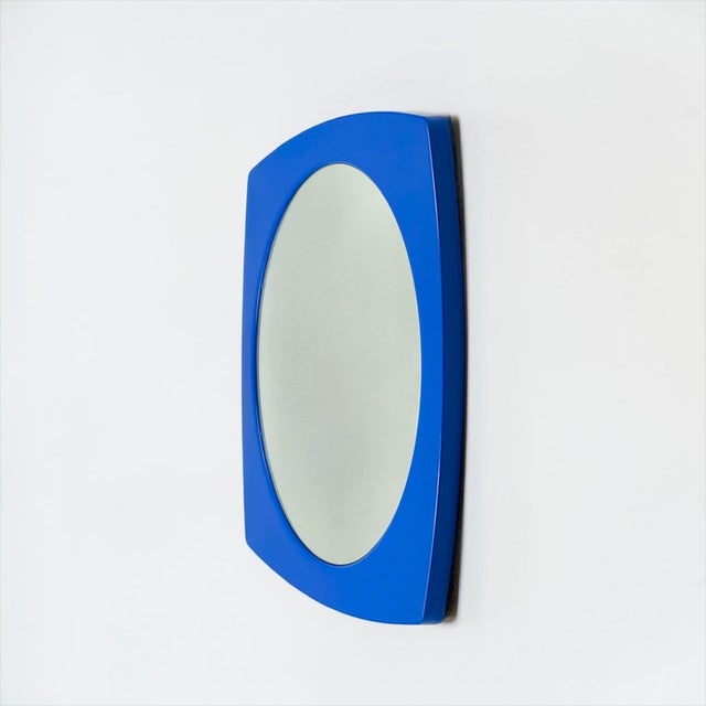 French Space Age mirror produced by Syla during the 1970s with molded blue plastic frame and circular mirror glass. The...