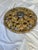 Round pierced acanthus-leaf ceiling rosette in carved wood with distressed gilt.
