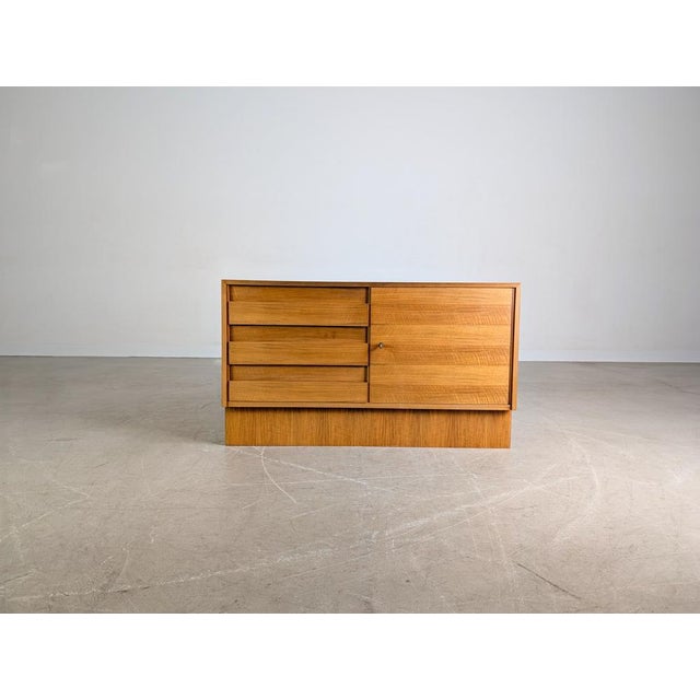 Beautiful small vintage chest of drawers made of high-quality walnut for sale. This small sideboard dates back to the...
