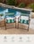 classic pair of mid-century folding patio chairs featuring warm stained wood frames and original green striped canvas...