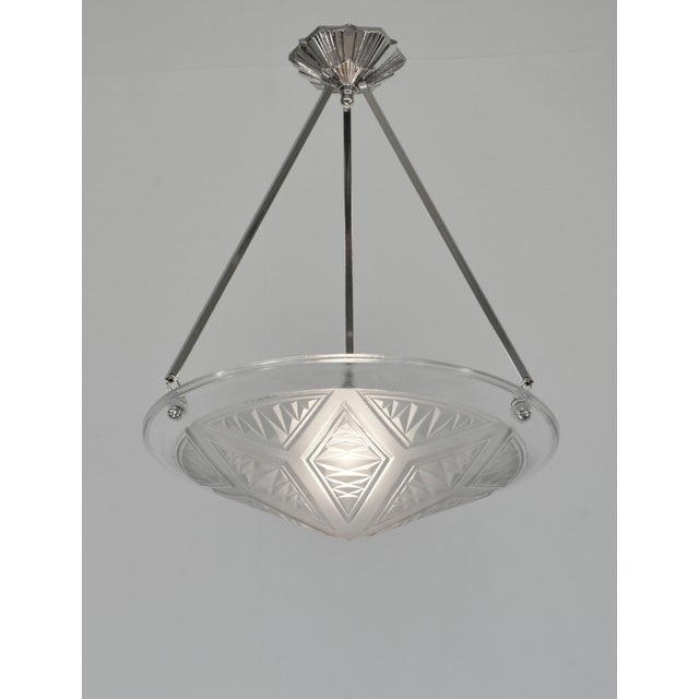 MAYNADIER A rare French 1930 art deco chandelier in nickel plated solid brass or bronze by Maynadier. The Paris France...