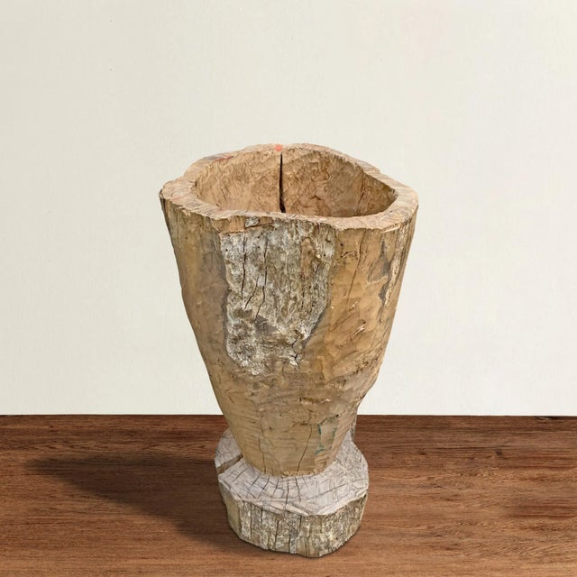 A large 19th century Central American wooden mortar with a beautifully hand-hewn texture and a well worn finish. Mortars...