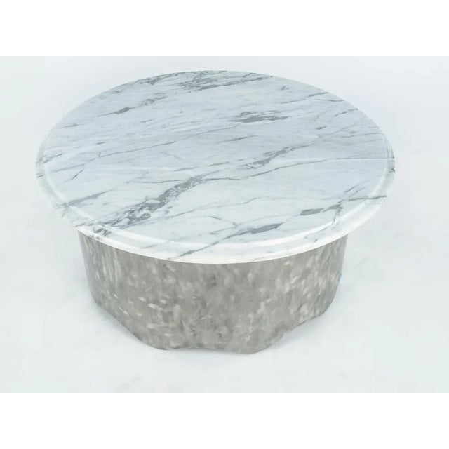 Introducing a timeless centerpiece, the Round Marble Table w/ Wave Base. Crafted to elevate your décor, this coffee table...