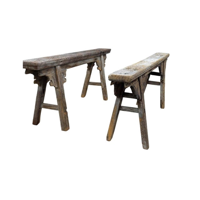 A pair of Chinese provincial elm benches with a beautifully weathered, silvered surface built up over long years of use....