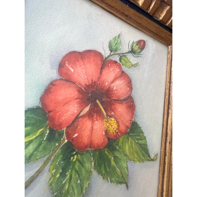 This vintage piece is an original floral watercolor painting on textured paper, featuring a vibrant red hibiscus blossom...