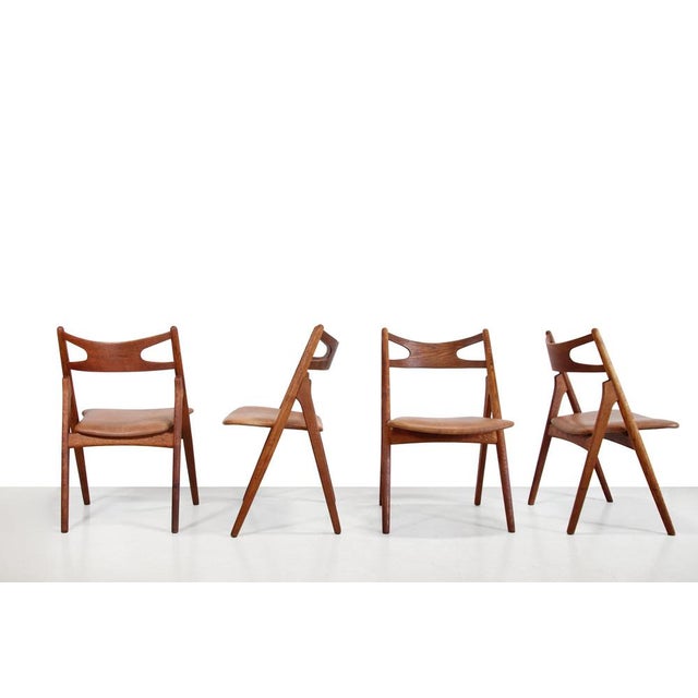 Very beautiful dining chairs, designed by Hans Wegner and produced by Carl Hansen and Son in Odense, Denmark. This is a...