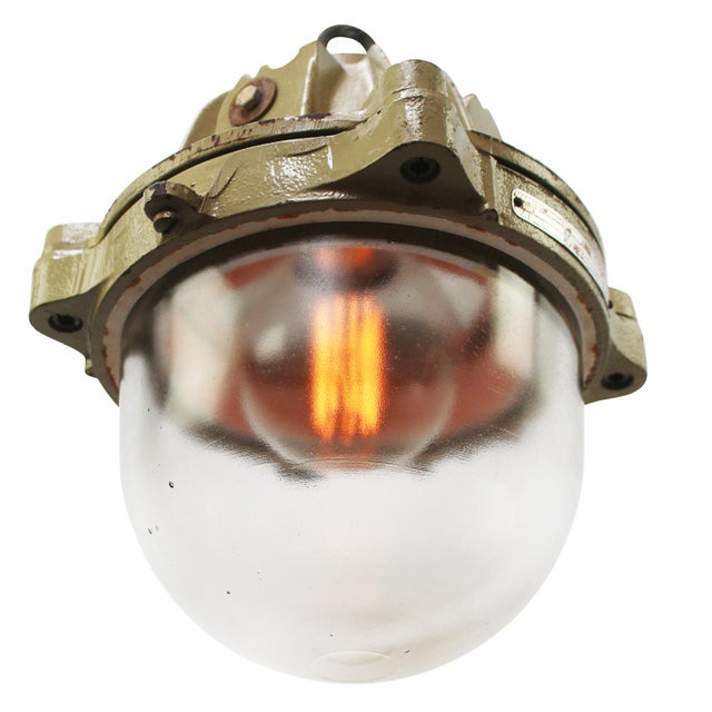 French industrial hanging lamp by mapelec amiens. 1977 brown / beige cast iron with clear glass depending on destination,...