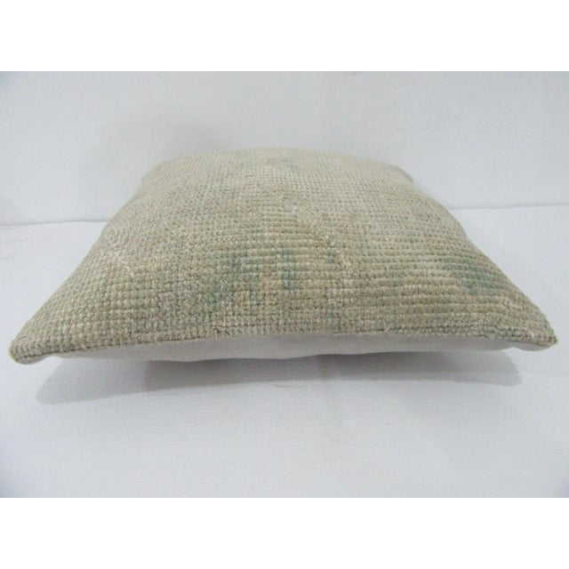 Decorative pillow cover made from a vintage Turkish handknotted rug. Backed with good quality cotton fabric. Pillow...