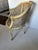 Elegant vintage French Louis XV style barrel back armchair featuring exquisite woven cane detailing and a beautifully...