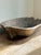 An evocative antique wooden dough trough featuring a beautifully weathered surface, sculptural elongated proportions, and...
