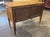 This 19th century walnut neoclassical inlaid 2 drawer table is a luxurious and stylish antique piece of furniture. The...