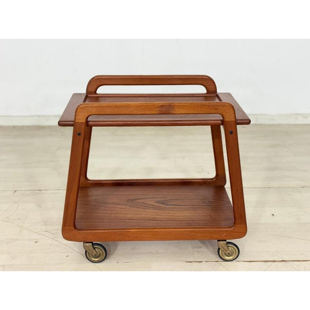Beautiful, timeless serving trolley from Sika Møbler (Made in Denmark) in authentic Danish mid-century design. The tea...