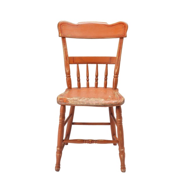 Set of four half spindle back, plank seat side chairs in original oxide red finish. All joints have been disassembled,...