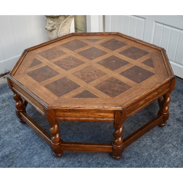 Vintage (1970's) Octagonal Coffee Table has a Jacobean Style. Madde by Baker Furniture. The Wood is Oak & Bur Wood with a...