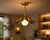 Crafted from solid brass, this handcrafted scalloped pendant light features a flowing brass shade surrounding a softly...