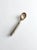 A vintage studio pottery serving spoon featuring a soft gray and white glaze accented with warm russet-brown tones. The...