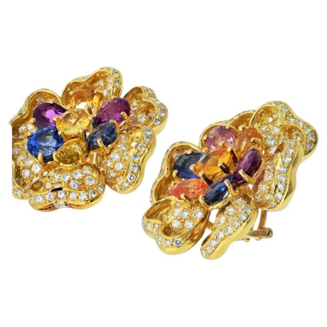This listing is only for the earring Pin is sold The estate 18K yellow gold diamond and multicolor sapphire flower...