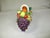 This is a vintage Capodimonte hand-crafted ceramic basket overflowing with various types of hand painted fruit. It is made...