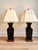 Striking pair of oversized vintage Asian-style table lamps featuring glossy black-brown glazed ceramic bodies with...