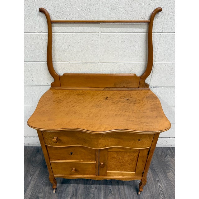 This is a beautiful antique birdseye maple washstand, cabinet, commode, or dry sink dating to the late Victorian or early...